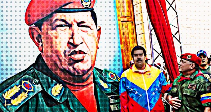 Maduro and a military officer salute a larger than life size portrait of Hugo Chavez