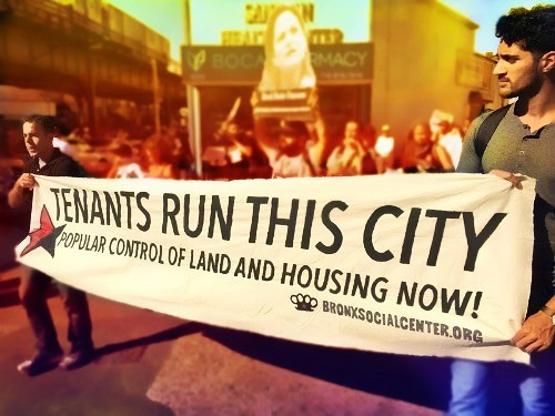 Demonstrators holding banner saying "Tenants Run This City" in Bronx, NYC