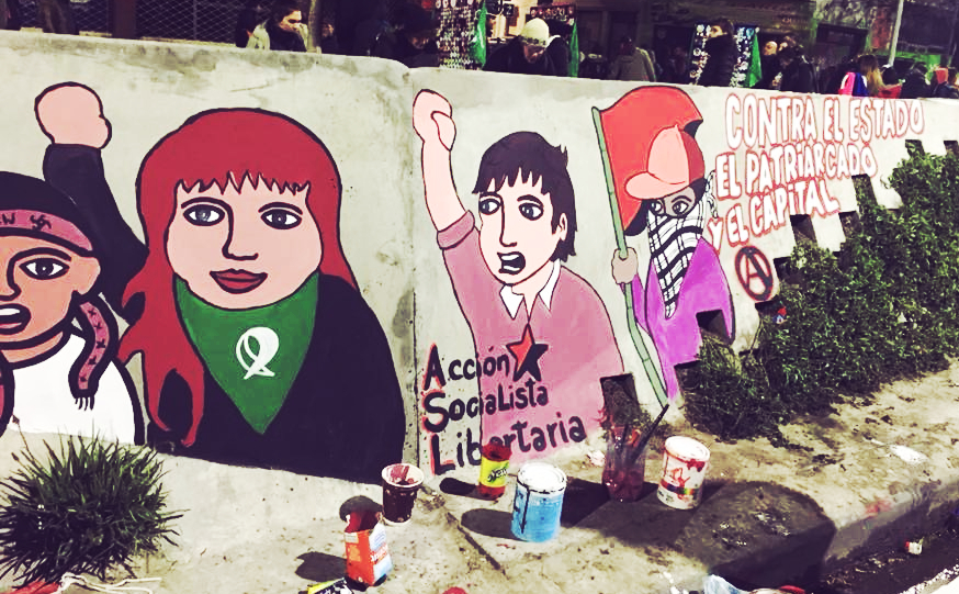 Wall mural in Buenos Aires, Argentina depicting protesters. Slogan "Contra el estado el patriarcado el capital"