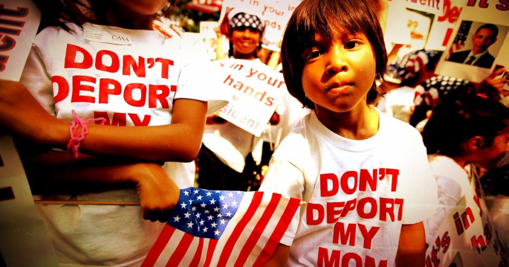 Photo of rally with participants wearing shirts with "don't deport my mom."